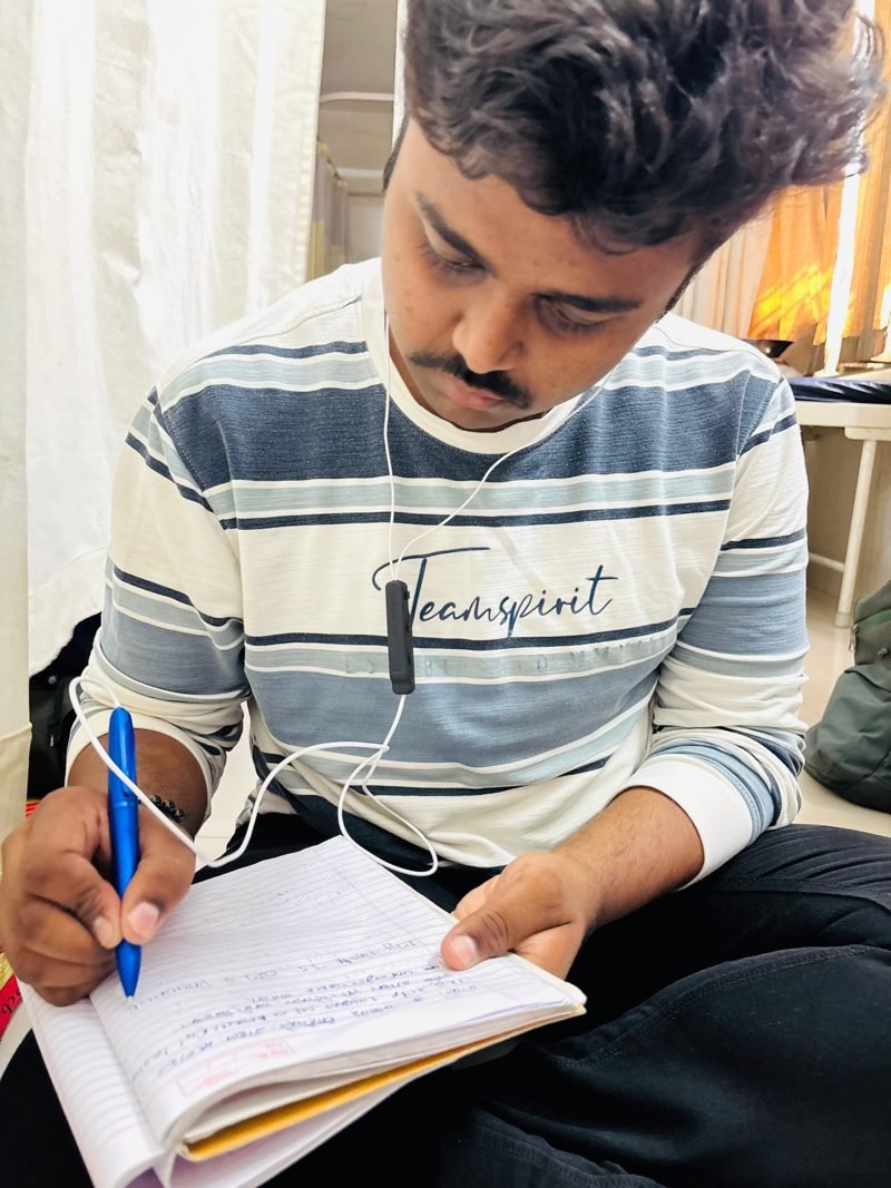 Student studying with Reed at the Amravati field pilot