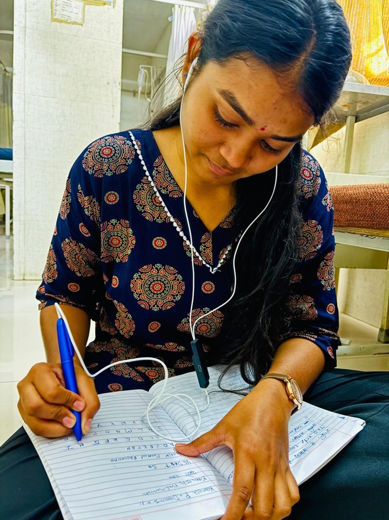 Student studying with Reed at the Amravati field pilot